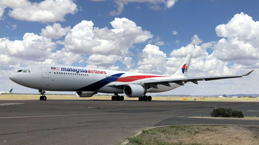 Malaysia Airlines plane on the tarmac.