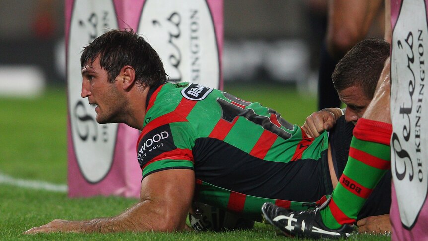 Burrowing over ... Dave Taylor sneaks between the posts for South Sydney's third try.