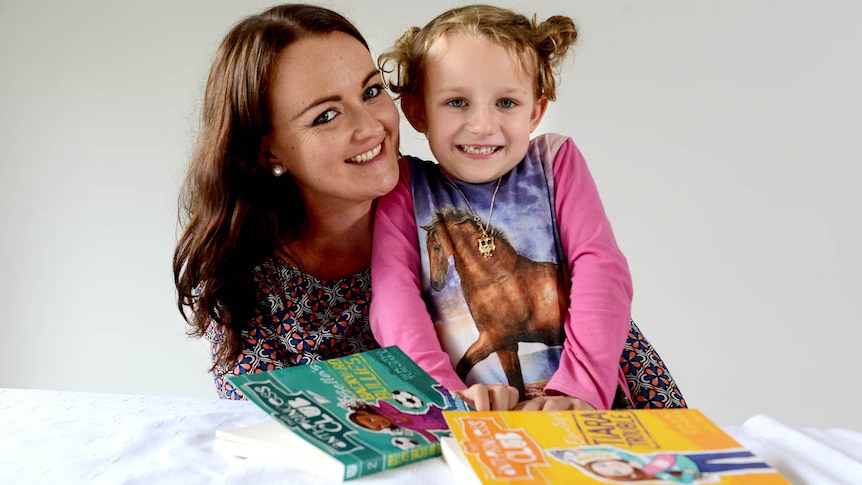 Samantha Turnbull with her daughter beside her, she questions traditional gender roles for children in her parenting.