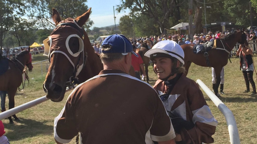 Singleton apprentice Mikayla Weir is all smiles beside the horse after winning the 164th Wallabadah Cup