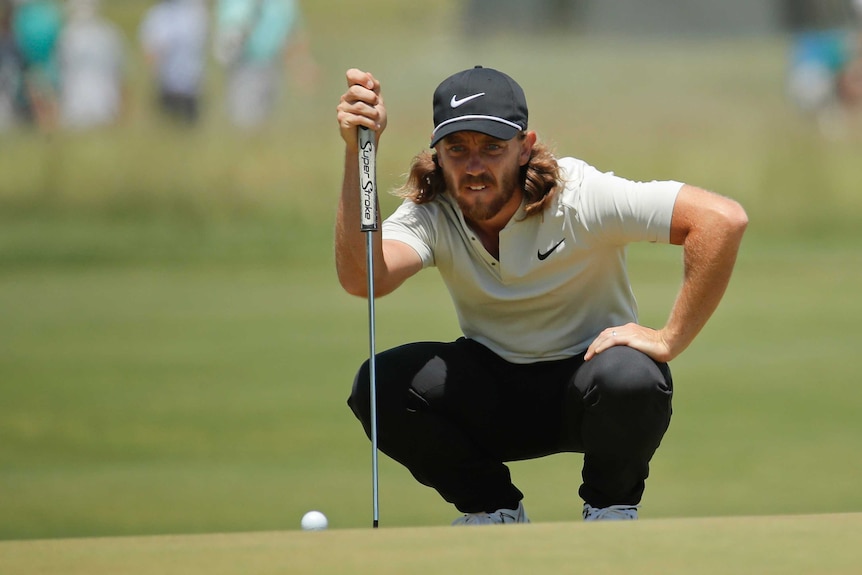 Tommy Fleetwood lines up a putt