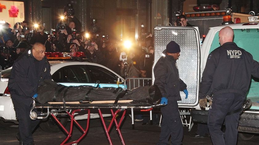 NYPD officers remove the body of actor Heath Ledger from his apartment building in New York City, where he was found dead on January 22, 2008.