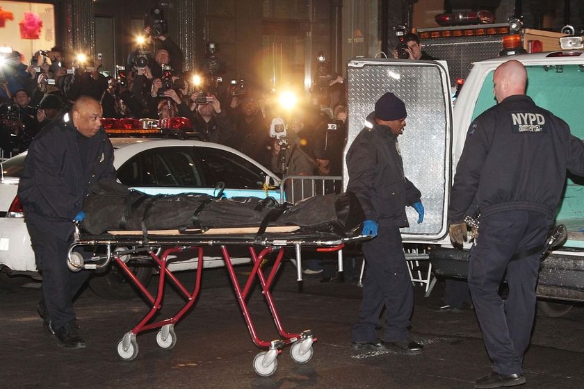 NYPD officers remove the body of actor Heath Ledger from his apartment building in New York City, where he was found dead on January 22, 2008.