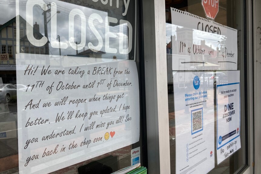 A sign in the window of a Lismore restaurant shows it will be closed from October 11 until December 1.