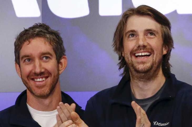 Scott Farquhar and Mike Cannon-Brookes both smile.