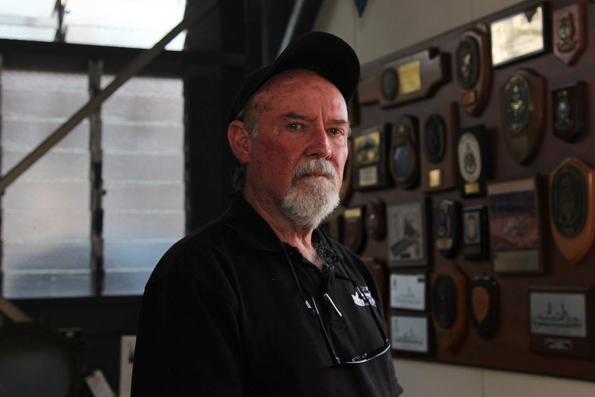 A portrait of Norman Cramp standing in the Darwin Military Museum.