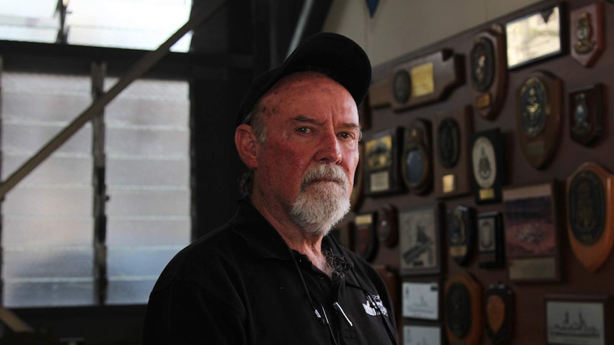 A portrait of Norman Cramp standing in the Darwin Military Museum.