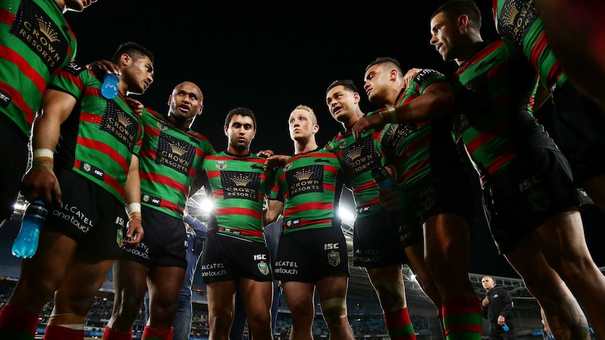 Rabbitohs in a huddle after their preliminary final win