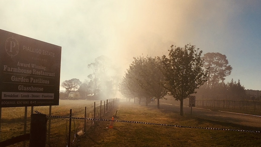 A smoky sky outside the Pialligo Estate entrance.