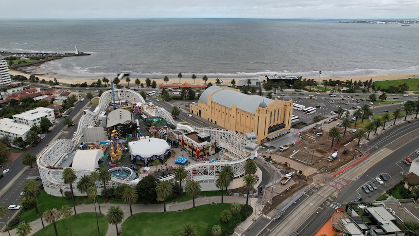 A drone shot of Luna Park and the Palais Theatre looking out over St Kilda beach. 