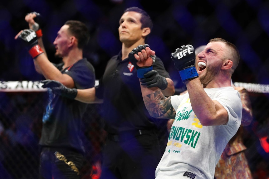 Alexander Volkanovski leans back and screams, with his fists clenched
