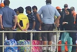 Asylum seekers bound for Malaysia arrive on Christmas Island on August 4, 2011.
