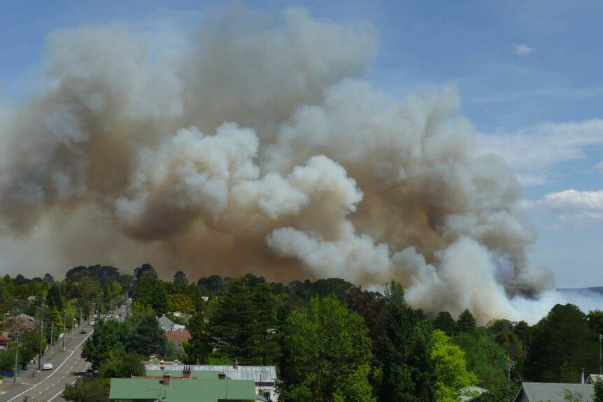 Smoke billows from a bushfire that threatened homes at Katoomba in the Blue Mountains.
