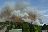 Smoke billows from the Katoomba bushfire before the blaze was brought under control.