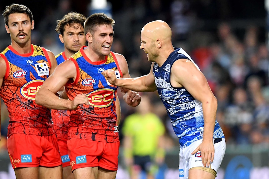 Gary Ablett lashes out with his right arm at Anthony Miles during the Gold Coast versus Geelong round 10 AFL match.