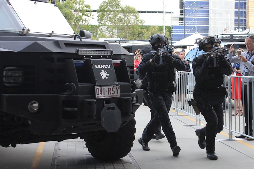 Tactical police at a media event on the Gold Coast ahead of a training drill ahead of the Commonwealth Games.
