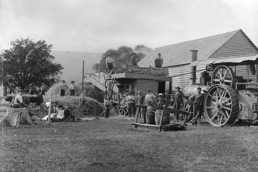 an old black and white photo of a farm scene
