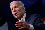 Close up of Joe Biden speaking at podium.