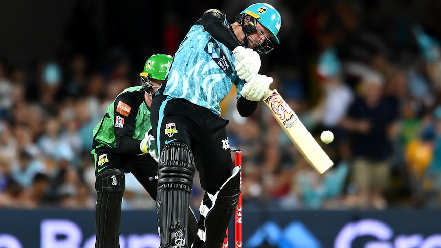 A Brisbane Heat BBL player hits the ball against the Melbourne Stars.