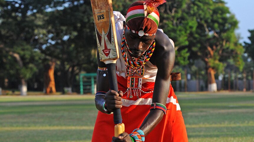 A Maasai batsman taps in the stumps at practise.
