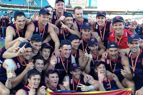 Bassett (right, in red) is off to Essendon