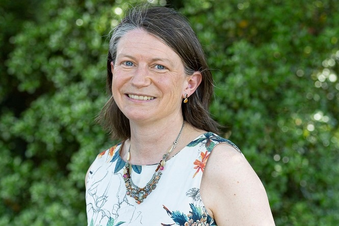 Woman smiling looking at the camera 