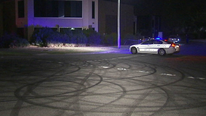 police car and skid marks at scene of police shooting