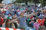Little girl at Carols By Candlelight in Hobart.