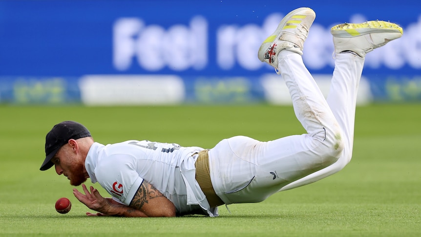 England fielder Ben Stokes drops the ball as he hits the ground.
