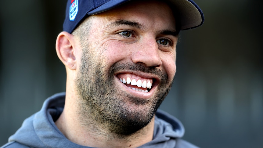 NSW Blues captain James Tedesco smiles during a press conference before a State of Origin game.