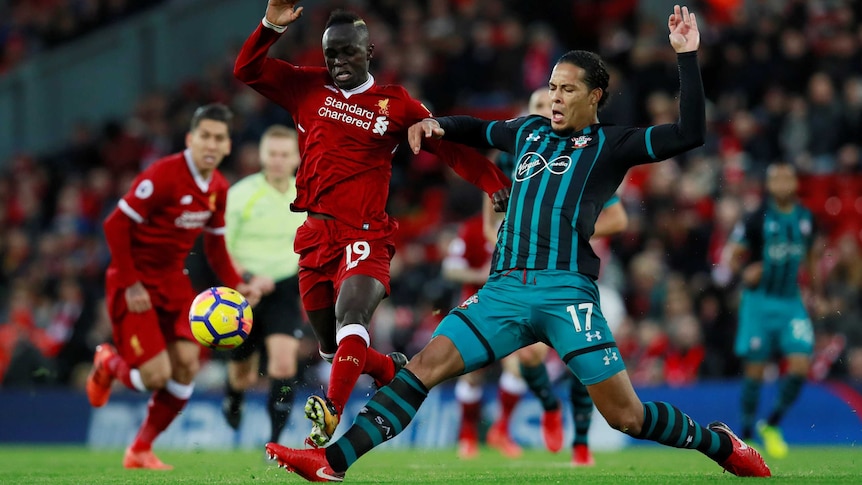 Liverpool's Sadio Mane duels with Southampton's Virgil van Dijk at Anfield on November 18, 2017. 