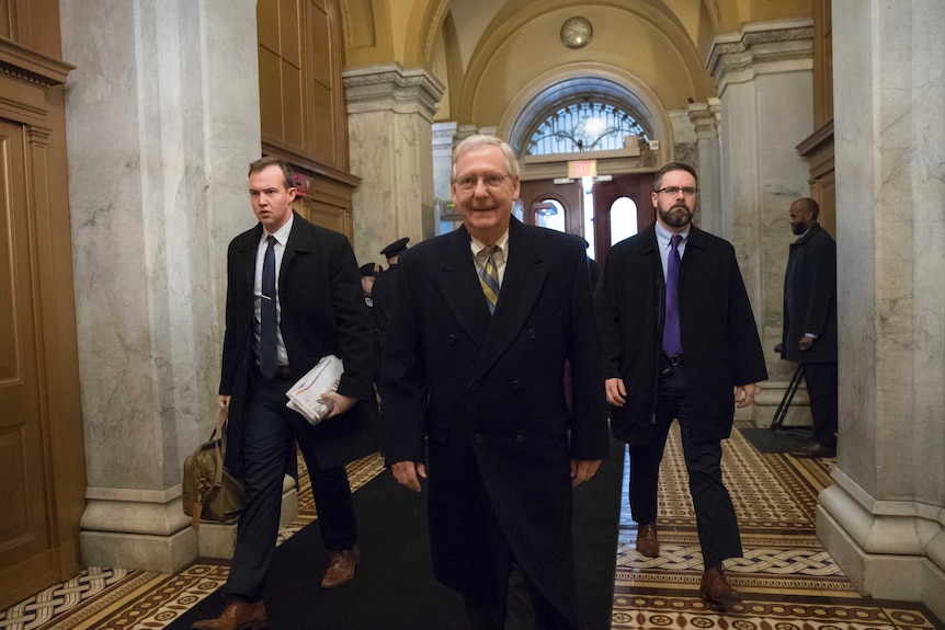 Senate Majority Leader Mitch McConnell, R-Ky., arrives at the Capitol in Washington Friday.