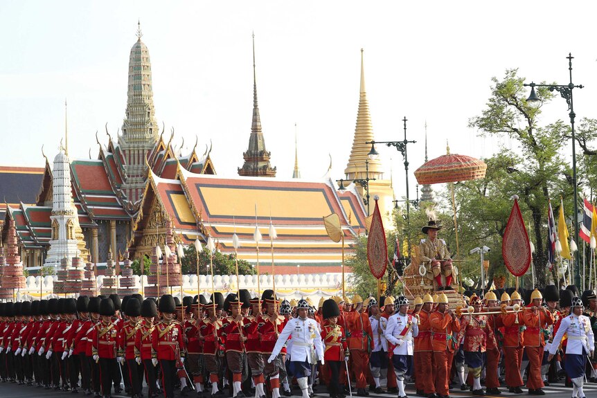 Thailand's King Maha Vajiralongkorn is carried through Bangkok streets for the second day of his coronation