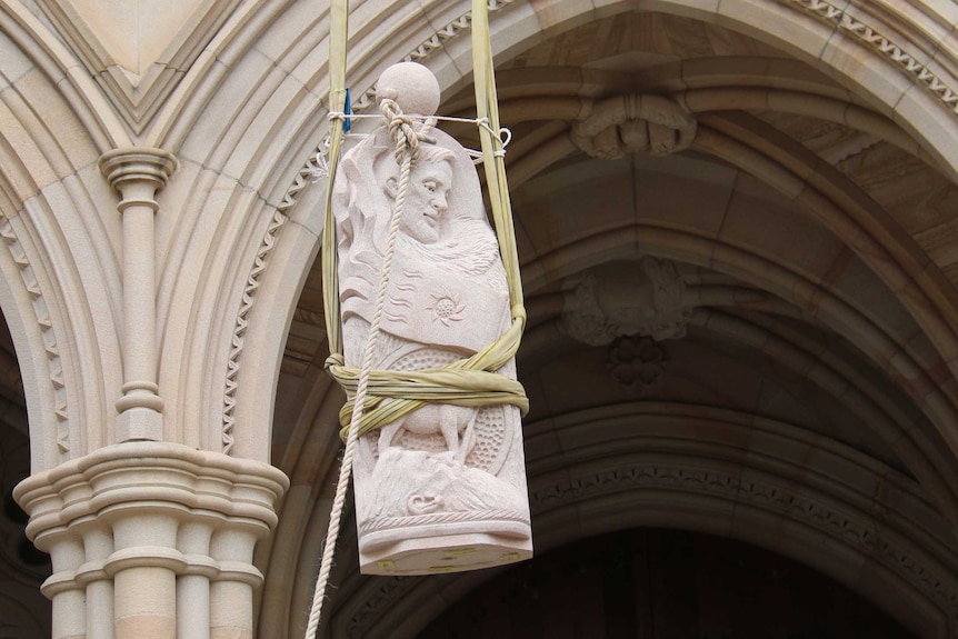 Wisdom being lifted into place at St John's Cathedral in Brisbane
