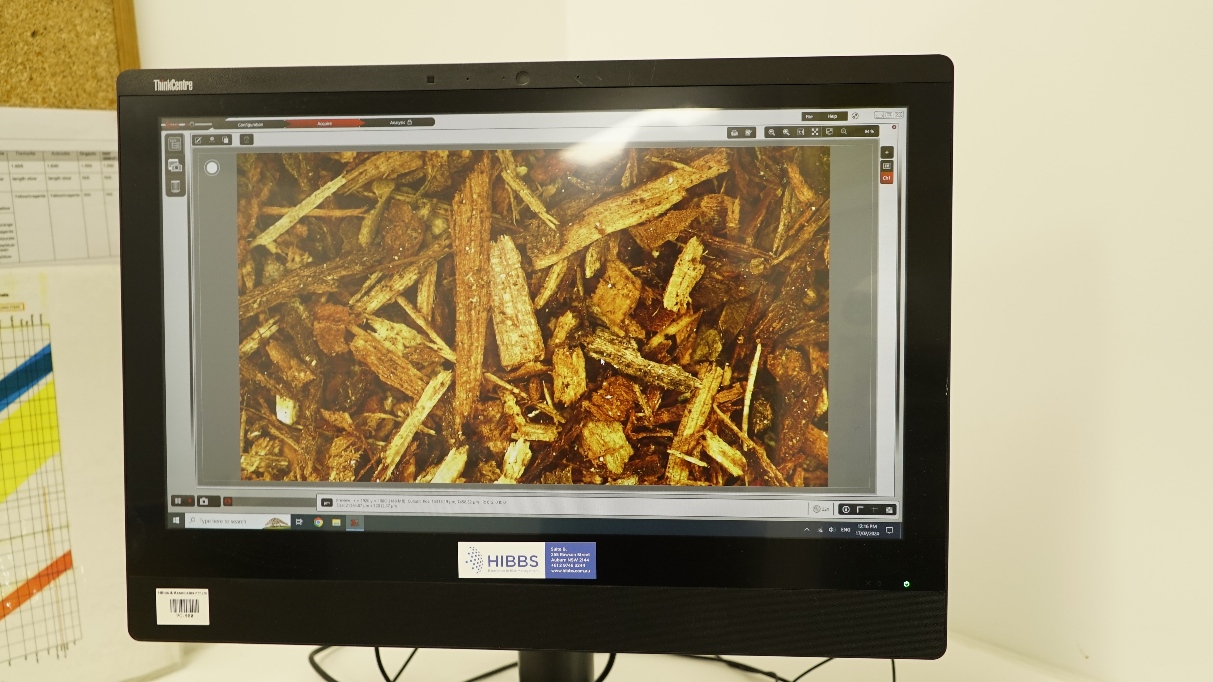 Mulch particles being examined under a microscope.