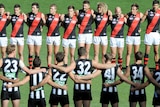 Collingwood and Essendon hold minutes silence on Anzac Day
