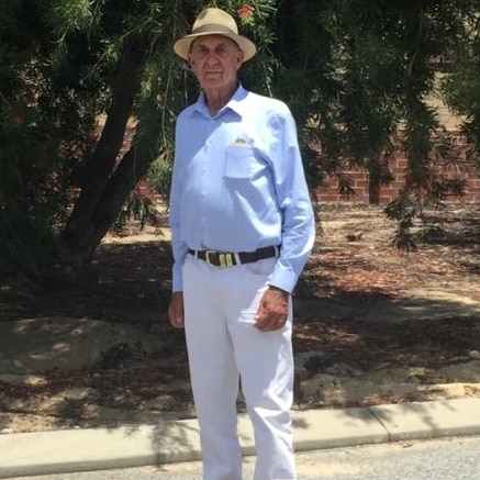 Man in hat and blue shirt