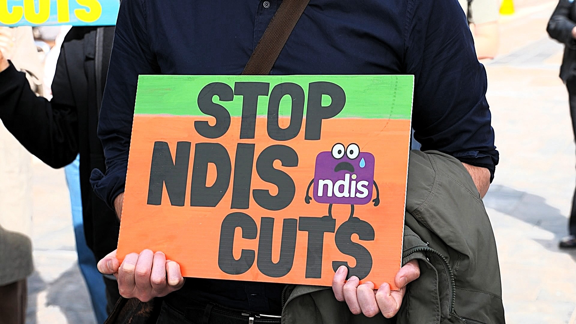 Billions slashed from NDIS packages as reassessments lead to more cuts