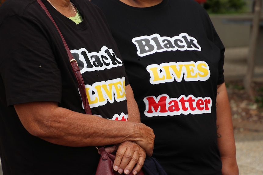 Close up on Black Lives Matter t-shirts in Red, yellow and black colours.