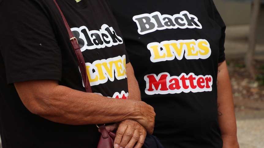 Close up on Black Lives Matter t-shirts in Red, yellow and black colours.