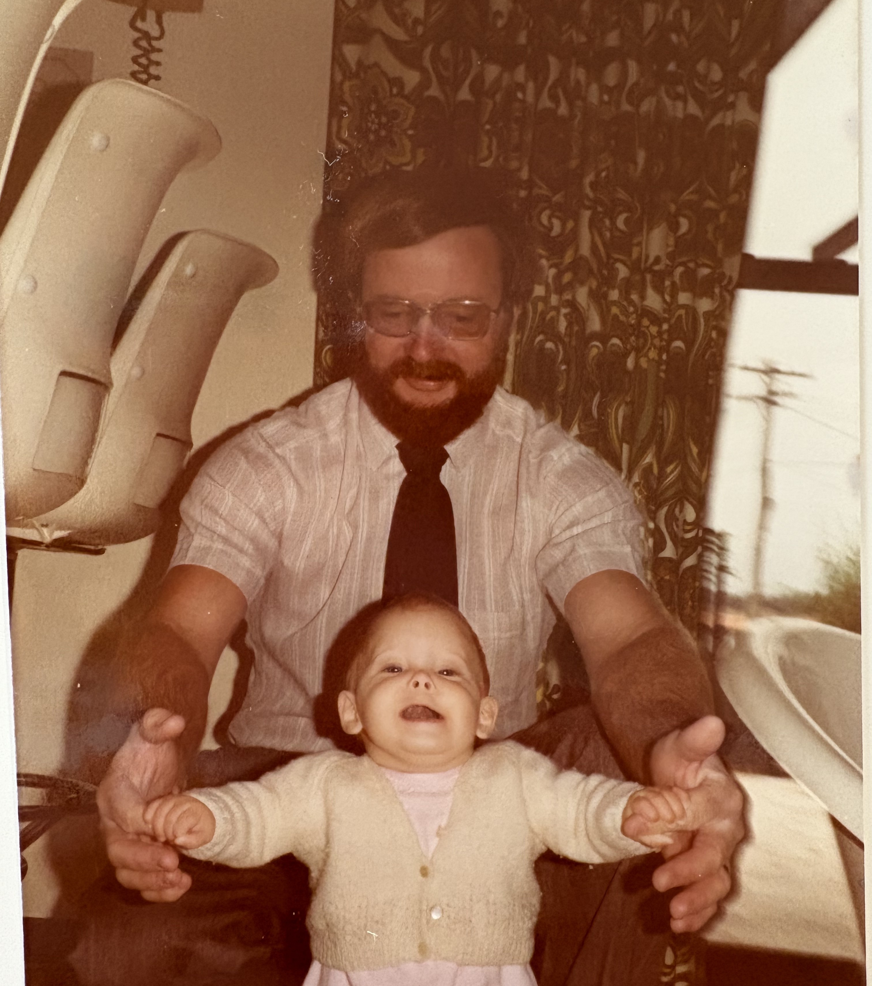 A sepia photograph of a man and a child