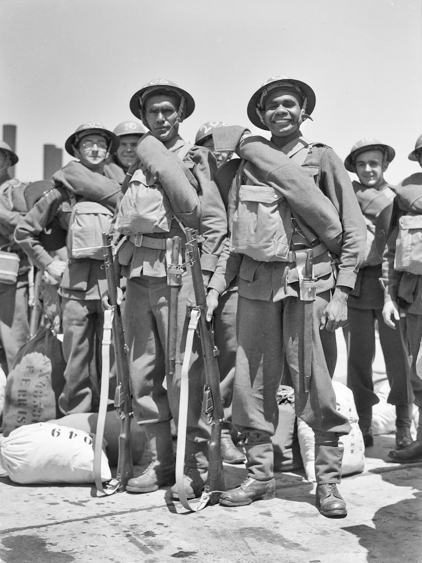 Group of World War One soldiers smile to camera