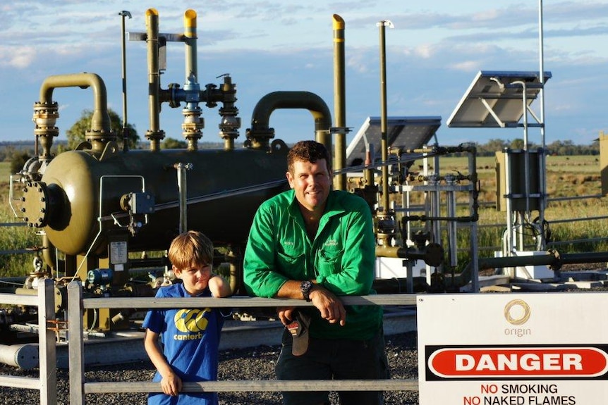 Scott and Charlie Lloyd at a CSG well head