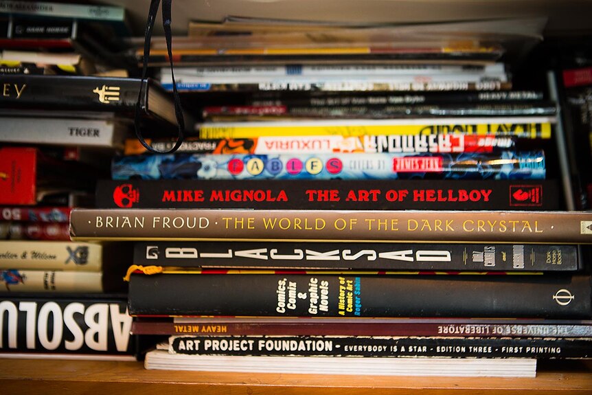 A stack of books used by comic artist Katie Houghton-Ward for inspiration