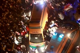 Protesters surround ambulances transporting injured protesters after clashes in Tahrir Square.