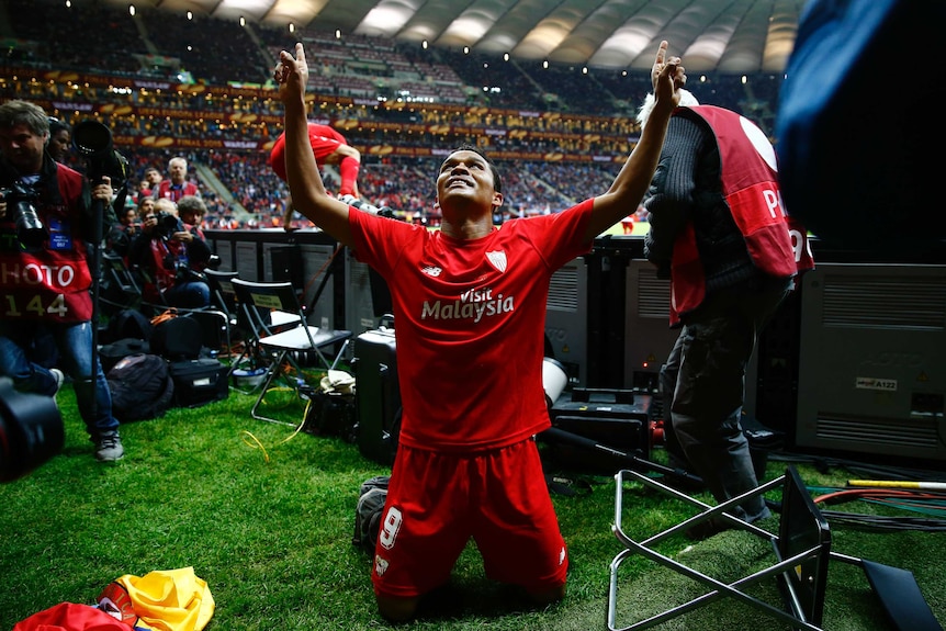 Carlos Bacca celebrates winner for Sevilla in Europa League final