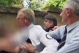 Terry Martin under attack outside court