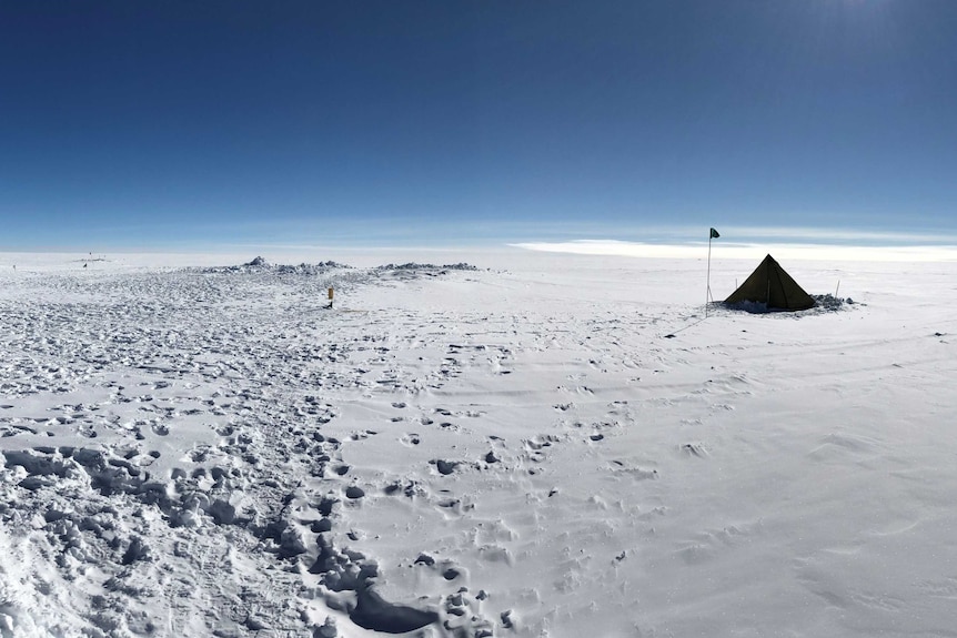 A tent in Antarctica on a cloudless day
