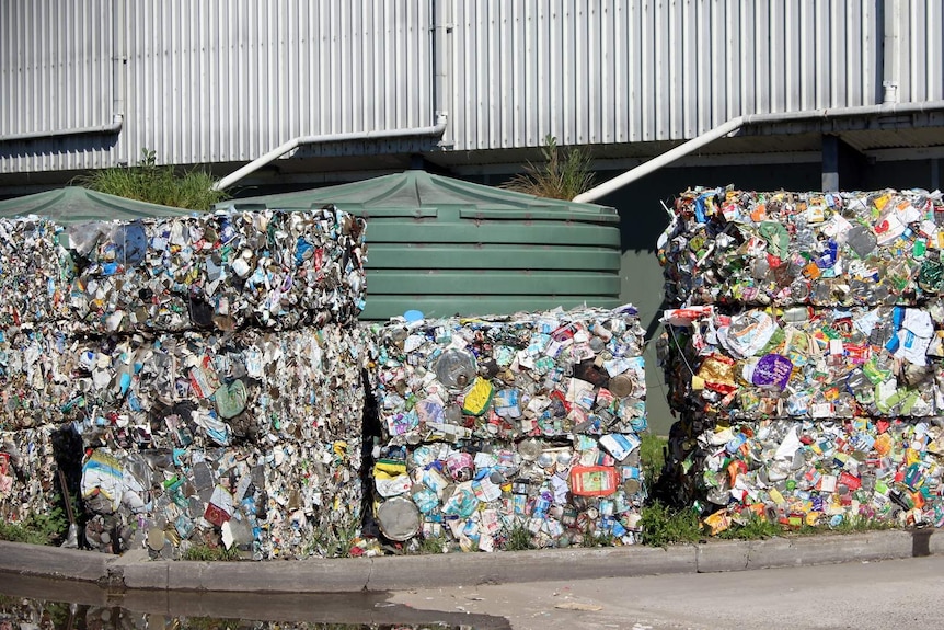 Bales of recycled metal containers waiting to be transported at the Materials Recovery Facility, Hume, ACT.