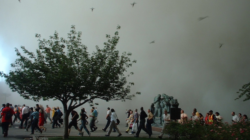 New Yorkers walk through Battery Park after the attacks of September 11, 2001.